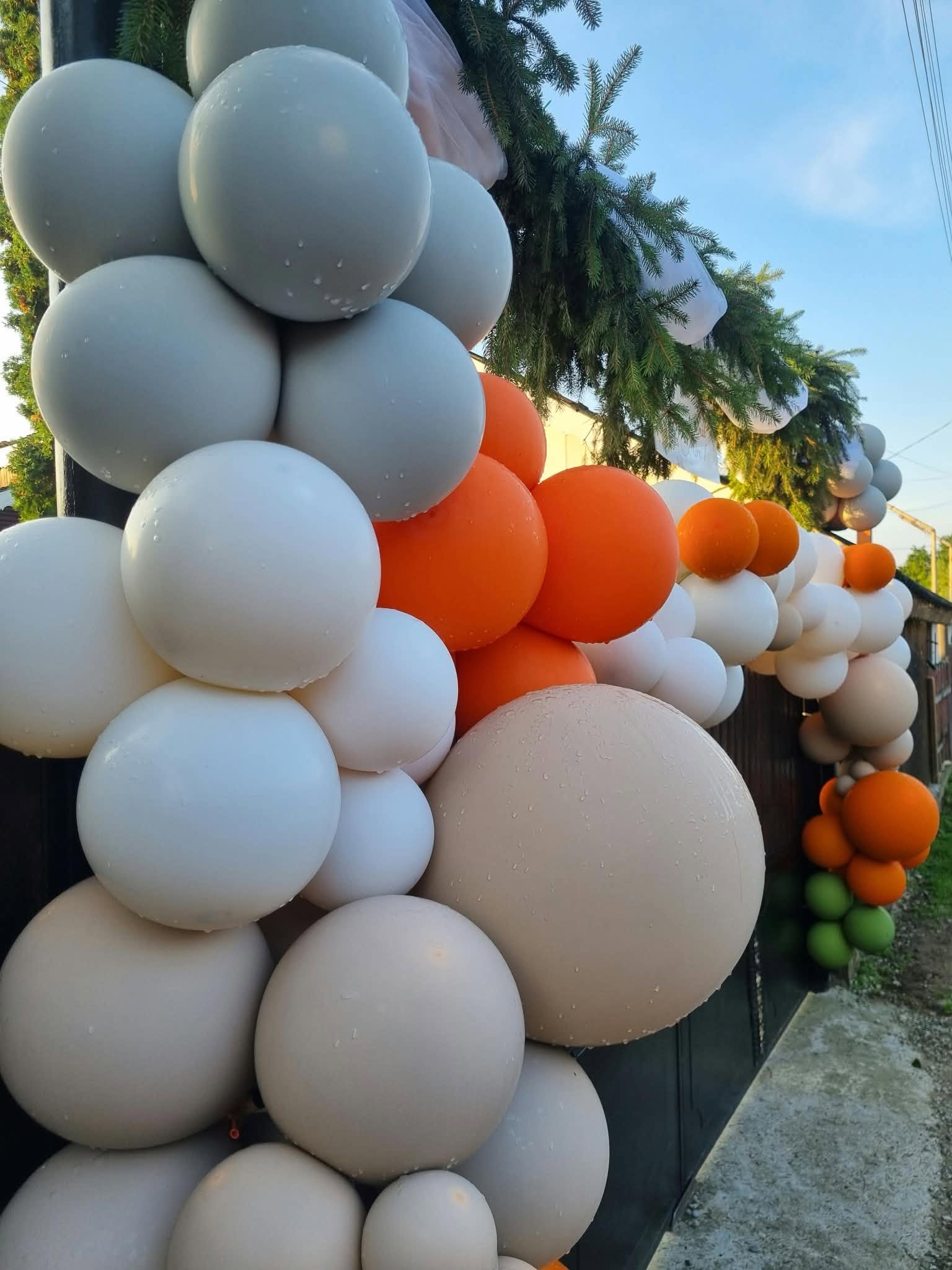 Air & Glow grey, orange and nude outdoor wedding balloon garland